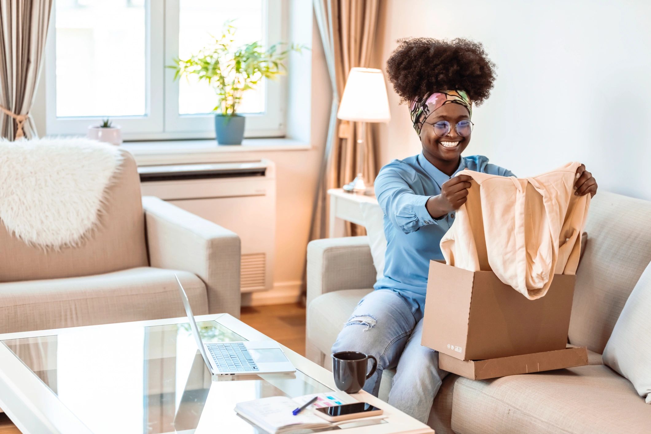 Customer unboxing a package at home